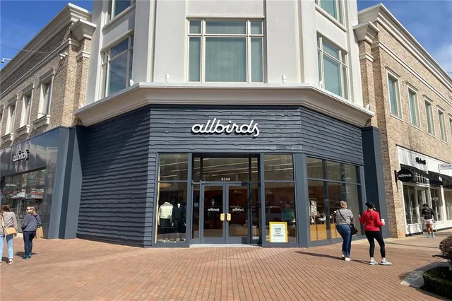 a view of a street with shops
