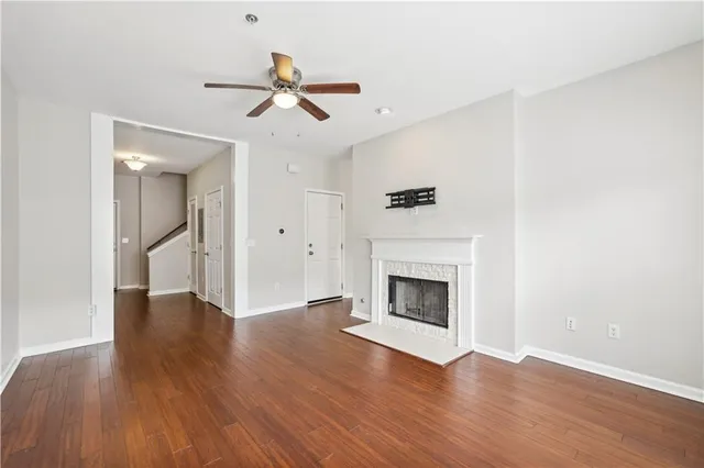 wooden floor in an empty room with a fireplace