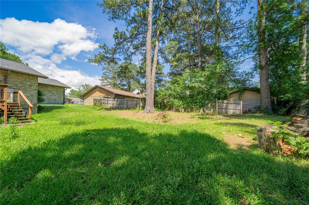 1006 Rikkity Lane Mount Pleasant, TX 75455 - Photo 28 of 39 a view of a house with backyard and sitting area