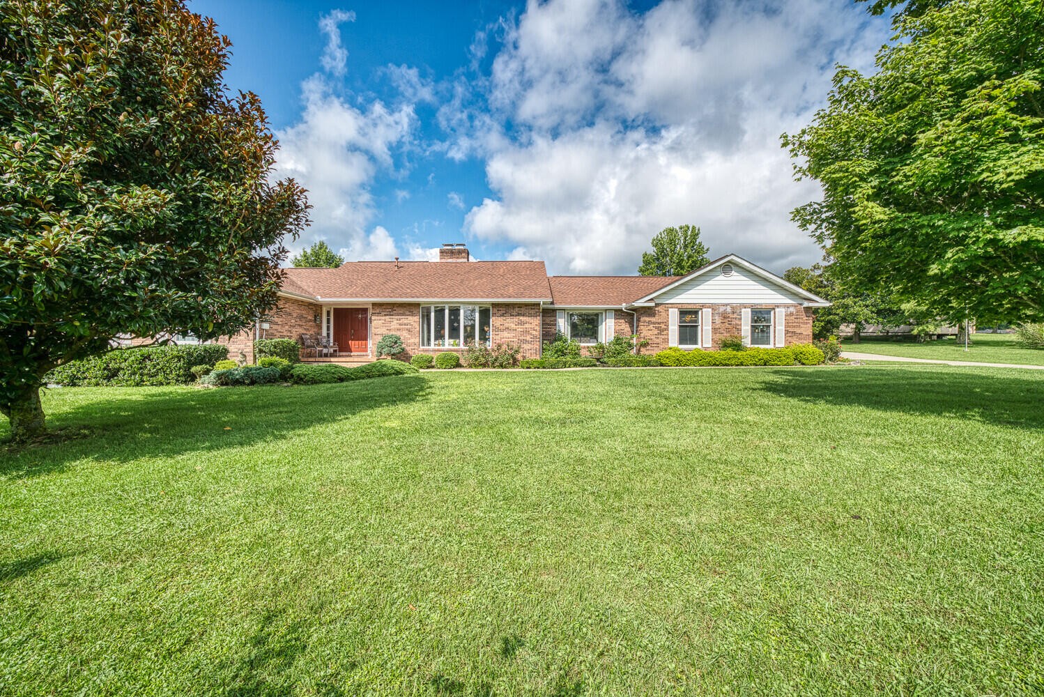 341 Roma Drive Crossville, TN 38555 - Photo 1 of 33 a front view of a house with garden