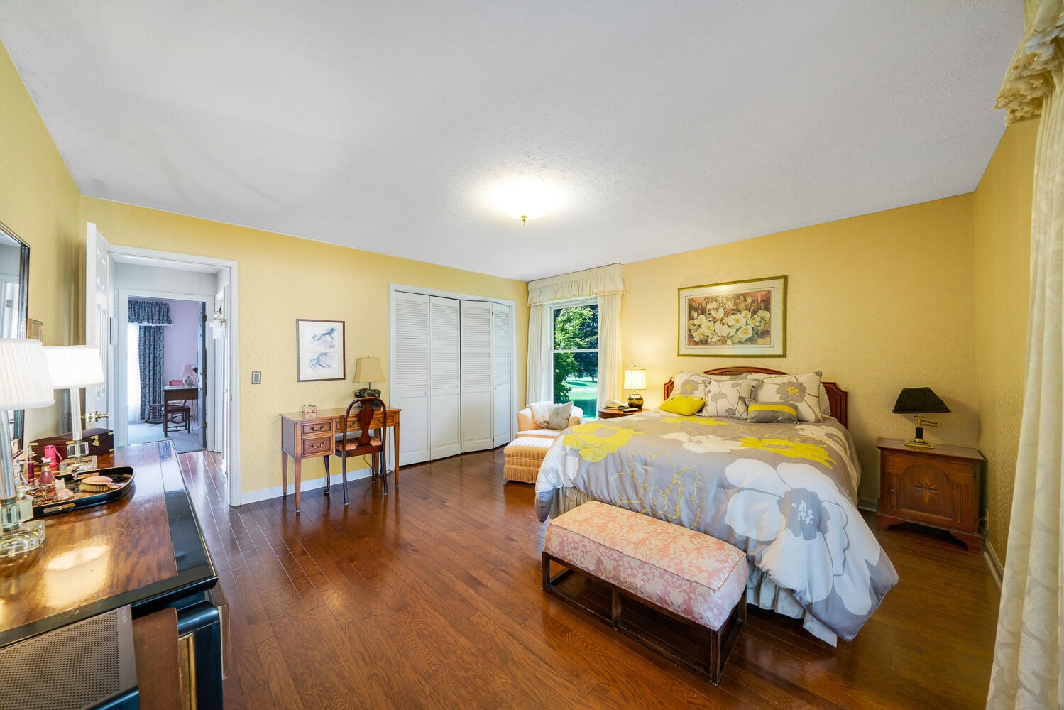 341 Roma Drive Crossville, TN 38555 - Photo 26 of 33 a bedroom with a bed and wooden floor