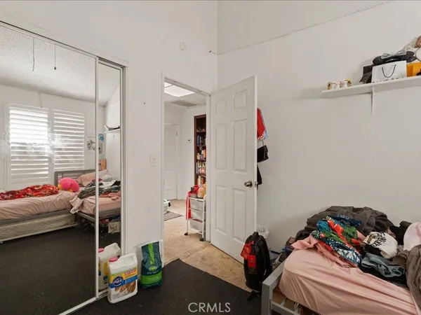 a bed room with a bed and a tv