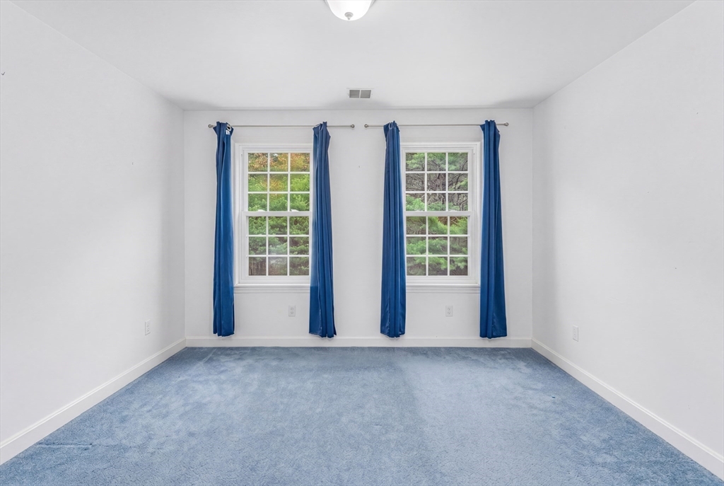 113 Greenwich Plains Road Ware, MA 01082 - Photo 24 of 42 a view of an empty room with a window