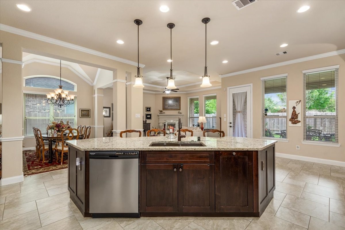 3771 Pinebrook Hollow Lane Spring, TX 77386 - Photo 12 of 50 a kitchen with granite countertop a sink and cabinets