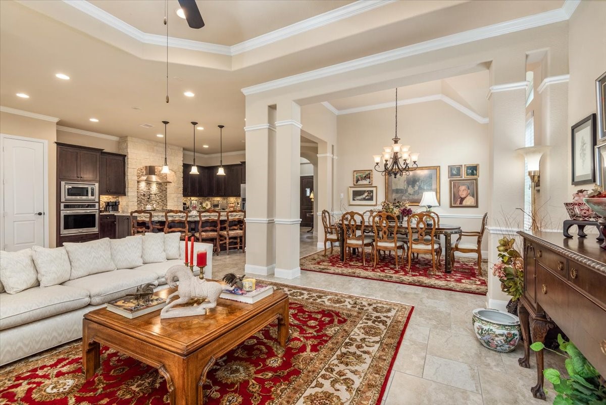 3771 Pinebrook Hollow Lane Spring, TX 77386 - Photo 50 of 50 A spacious open floor plan showcases LED recessed lighting, contemporary square columns, refined chair rail molding in the formal dining area, and elevated tray ceilings that add architectural elegance.