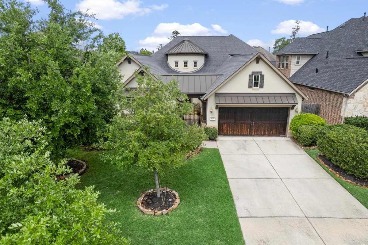 3771 Pinebrook Hollow Lane Spring, TX 77386 - Photo 2 of 50 a view of a house with a small yard and a large tree