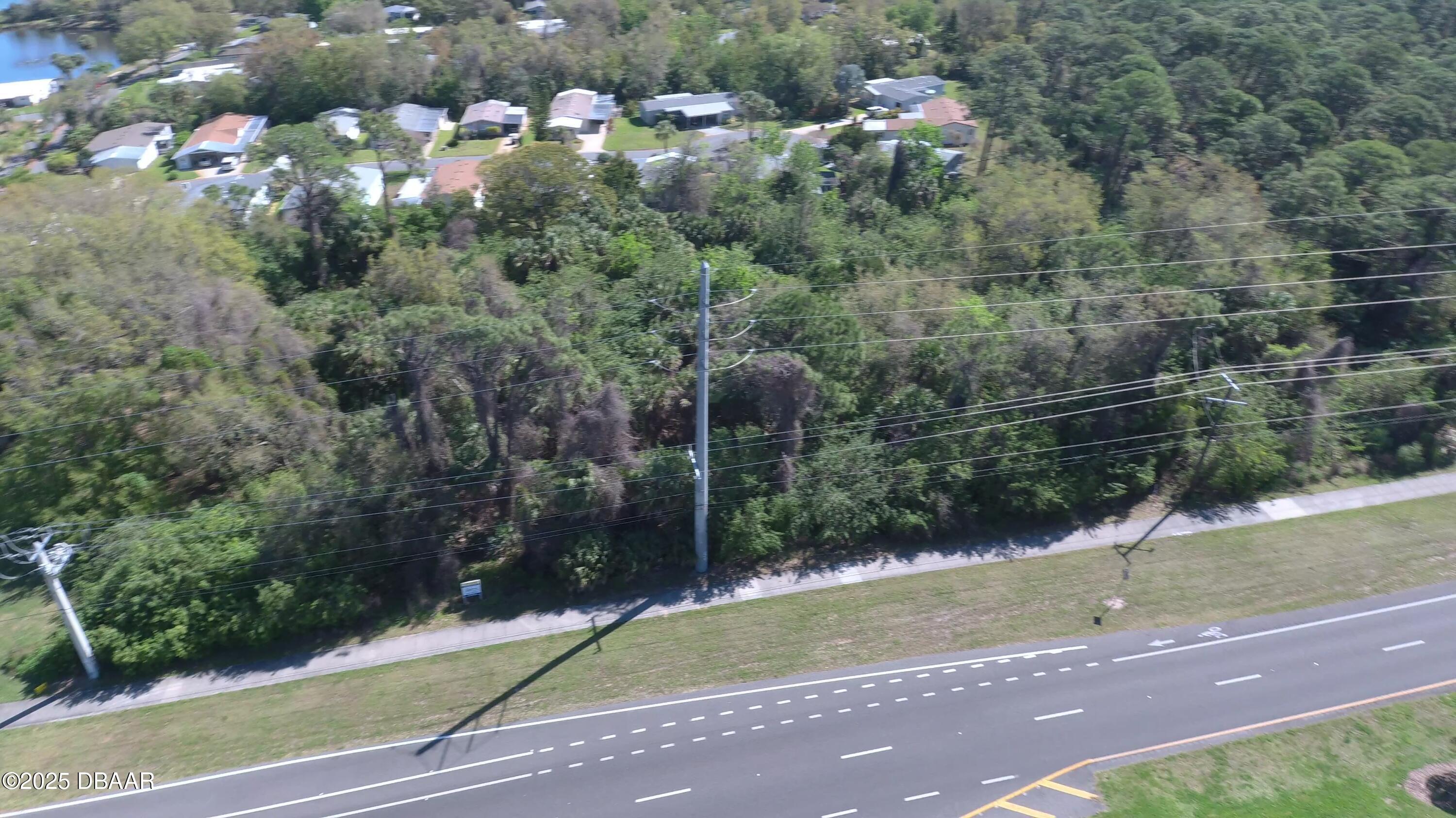 2771 South Ridgewood Avenue Edgewater, FL 32141 - Photo 1 of 5 AERIAL LOOKING EAST ALONG ISP