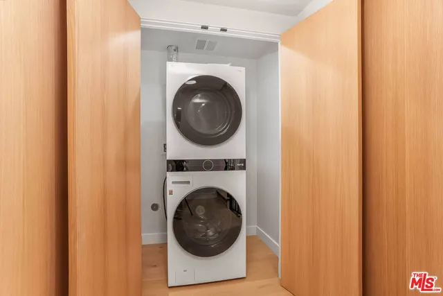 a view of a hallway with washer and dryer