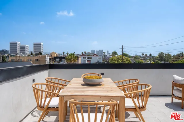 a view of a chairs and table on the terrace