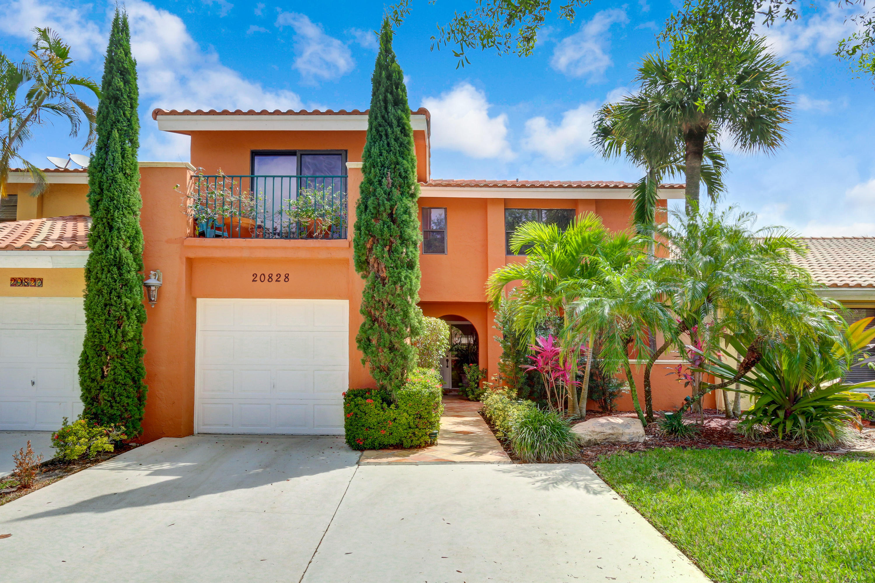 20828 Del Luna Drive Boca Raton, FL 33433 - Photo 1 of 20 a front view of a house with garden