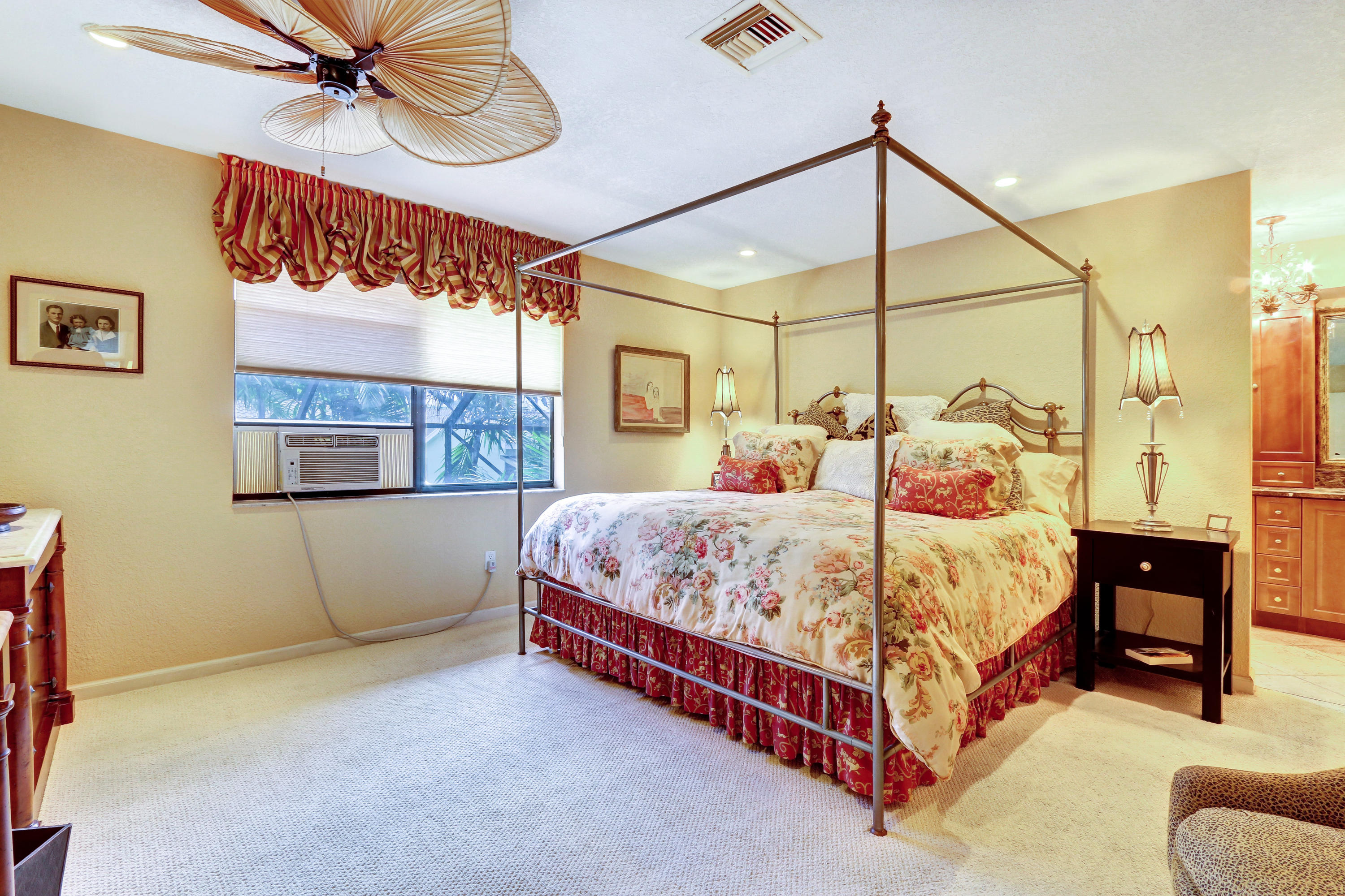 20828 Del Luna Drive Boca Raton, FL 33433 - Photo 12 of 20 a bed room with a bed and a ceiling fan