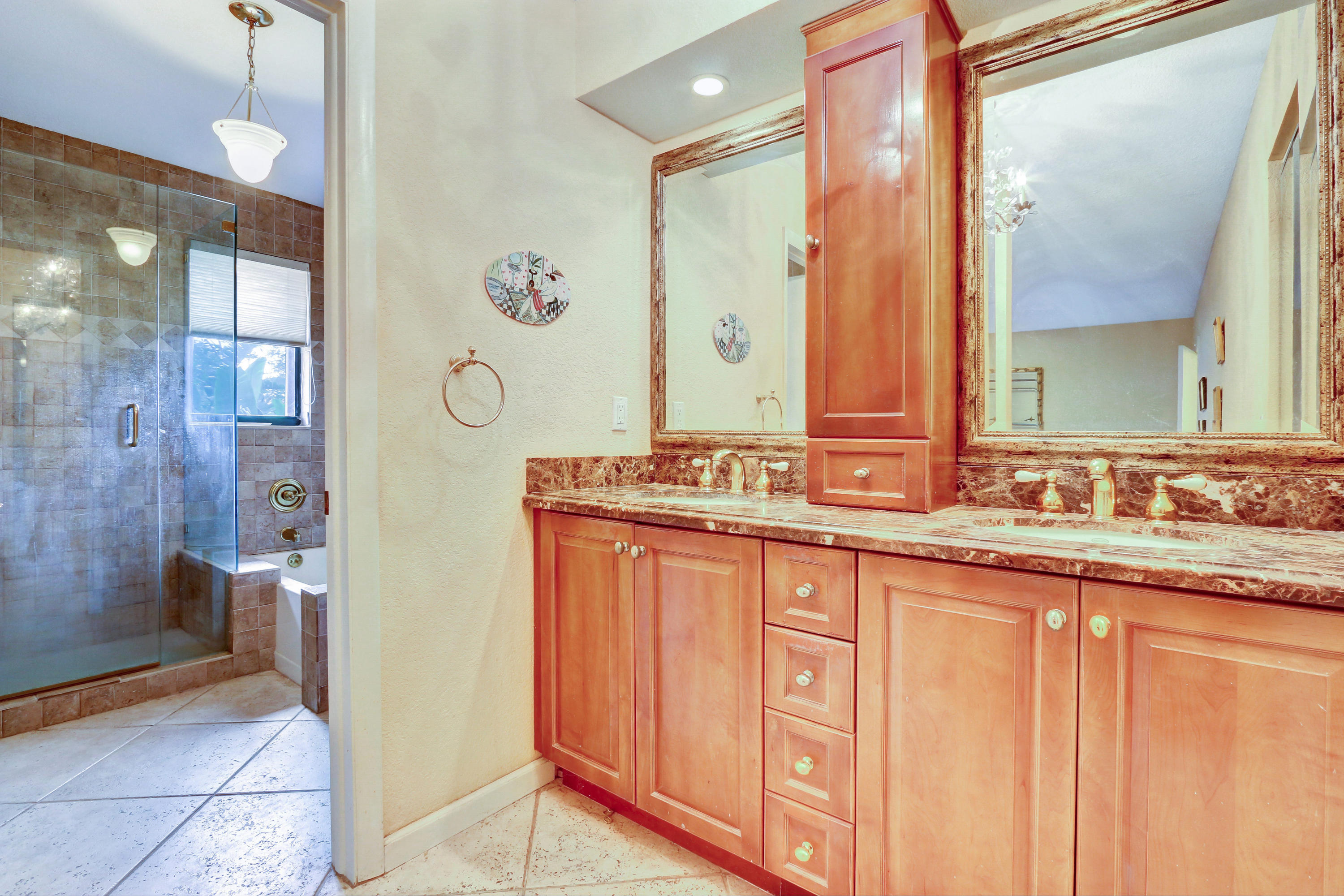 20828 Del Luna Drive Boca Raton, FL 33433 - Photo 13 of 20 a bathroom with a granite countertop sink a mirror and a shower