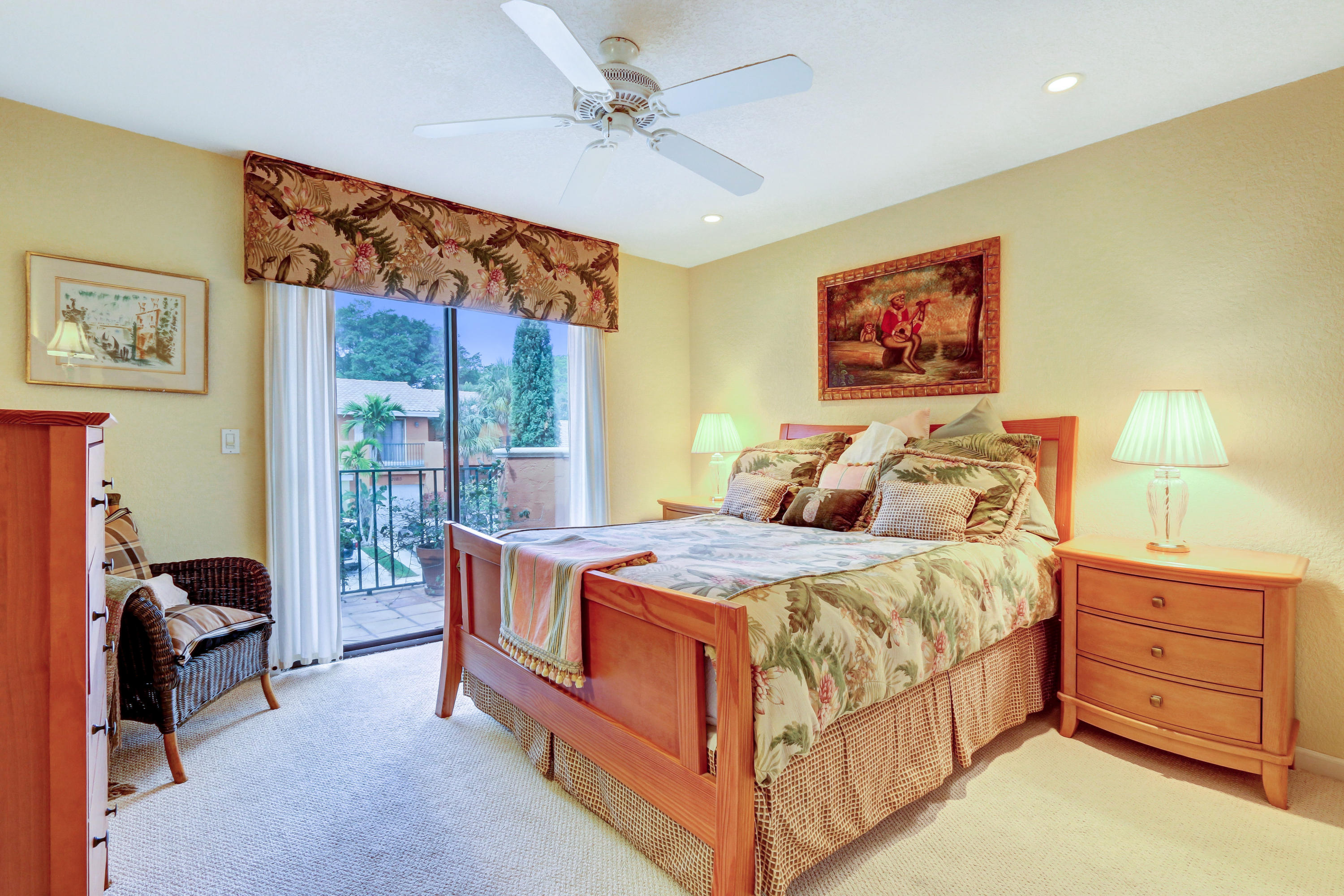 20828 Del Luna Drive Boca Raton, FL 33433 - Photo 16 of 20 a bedroom with a bed and a chandelier