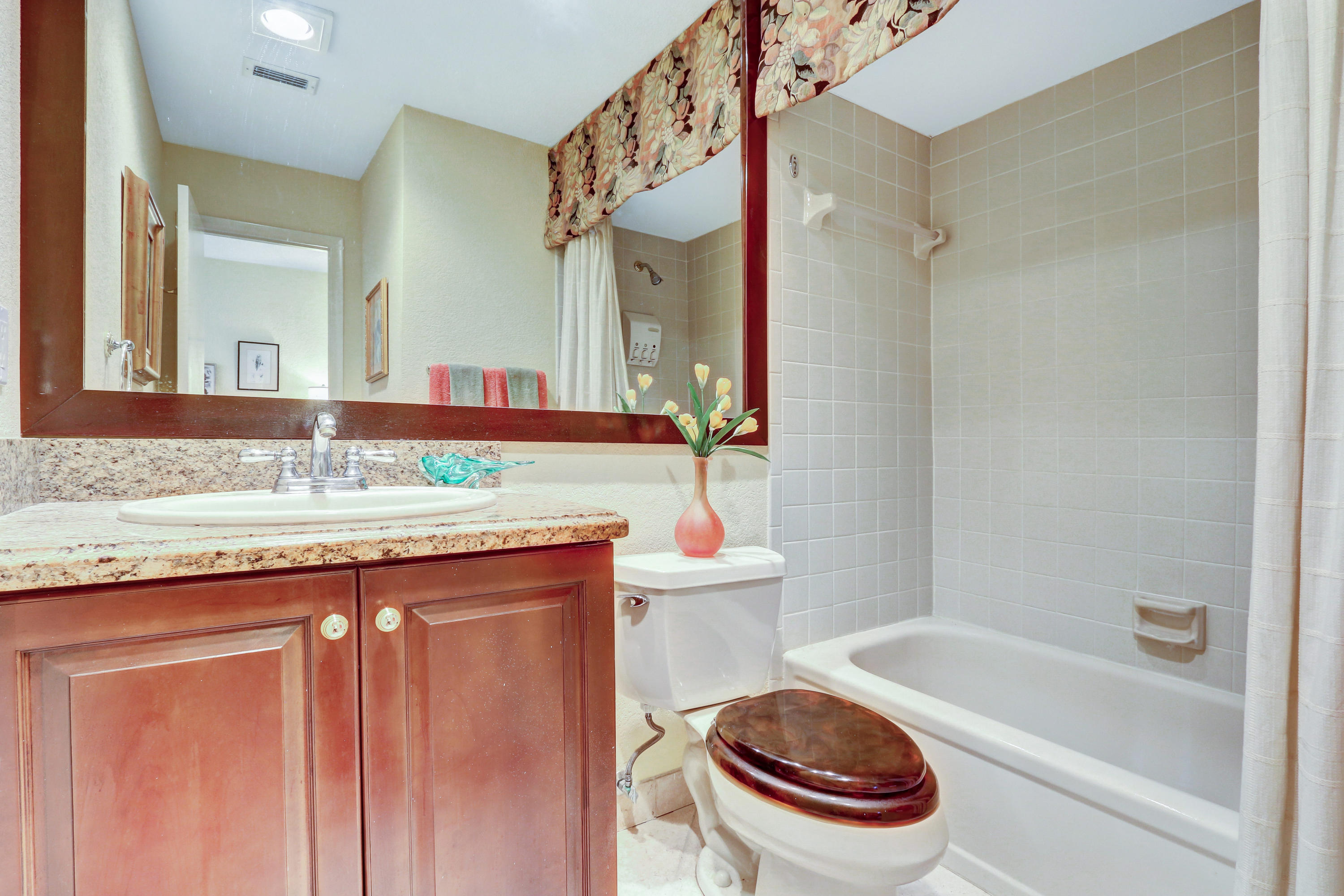 20828 Del Luna Drive Boca Raton, FL 33433 - Photo 17 of 20 a bathroom with a granite countertop sink a toilet and a mirror