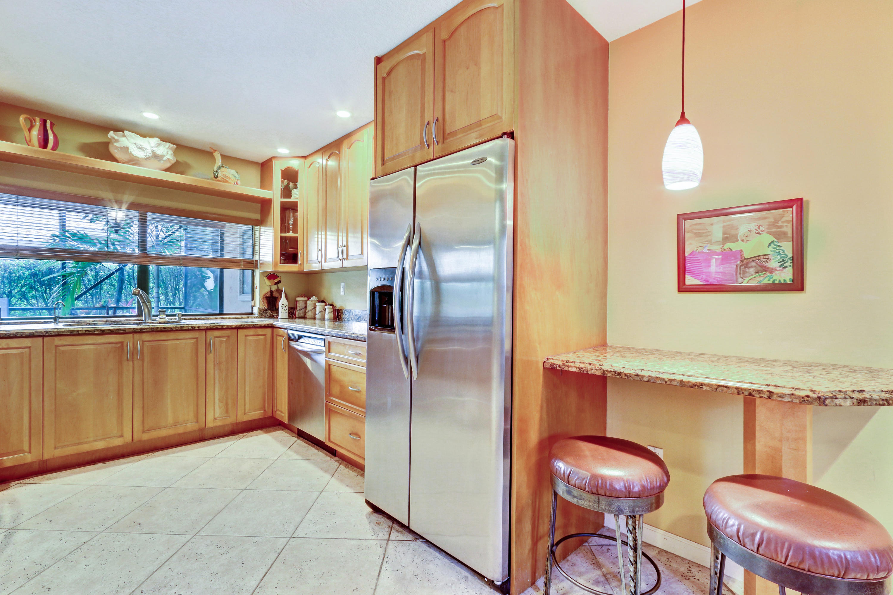 20828 Del Luna Drive Boca Raton, FL 33433 - Photo 7 of 20 a kitchen with stainless steel appliances granite countertop a refrigerator and a stove top oven