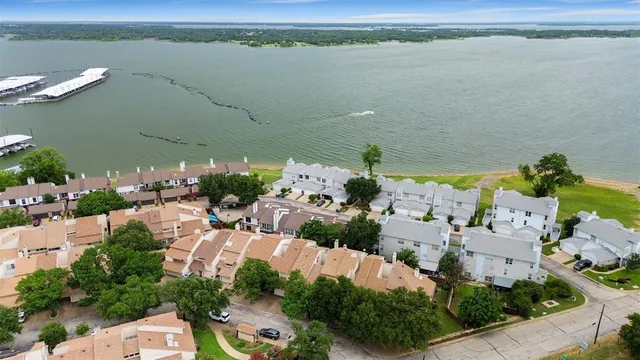 an aerial view of a house with a lake view