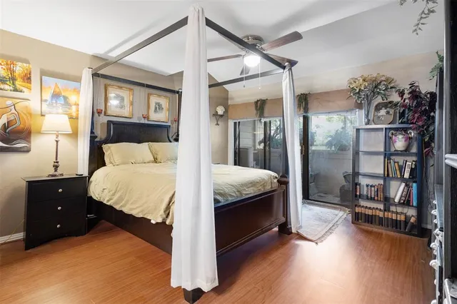 a bedroom with a bed and a night stand