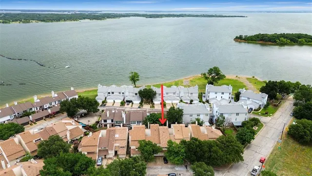 a view of a lake with a house in the background