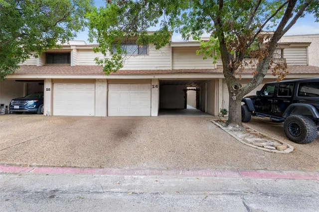 a view of a car park in front of house