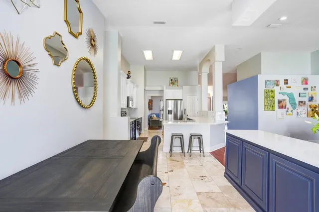 a living room with fireplace furniture and a wooden floor