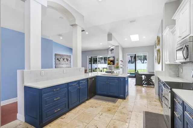 a living room with furniture windows and wooden floor