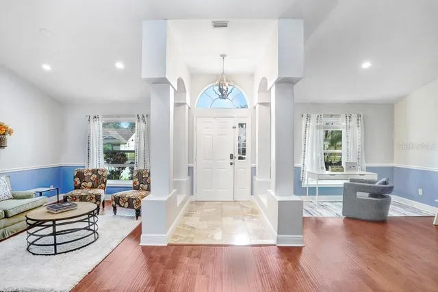a living room with furniture and a large window
