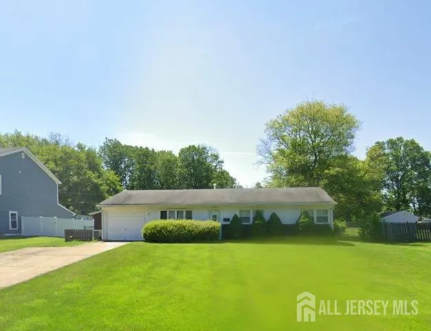 a view of swimming pool with garden and trees