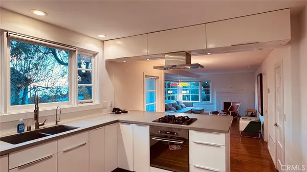 a kitchen with a stove and a sink