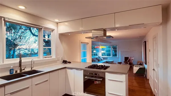 a kitchen with a stove and a sink