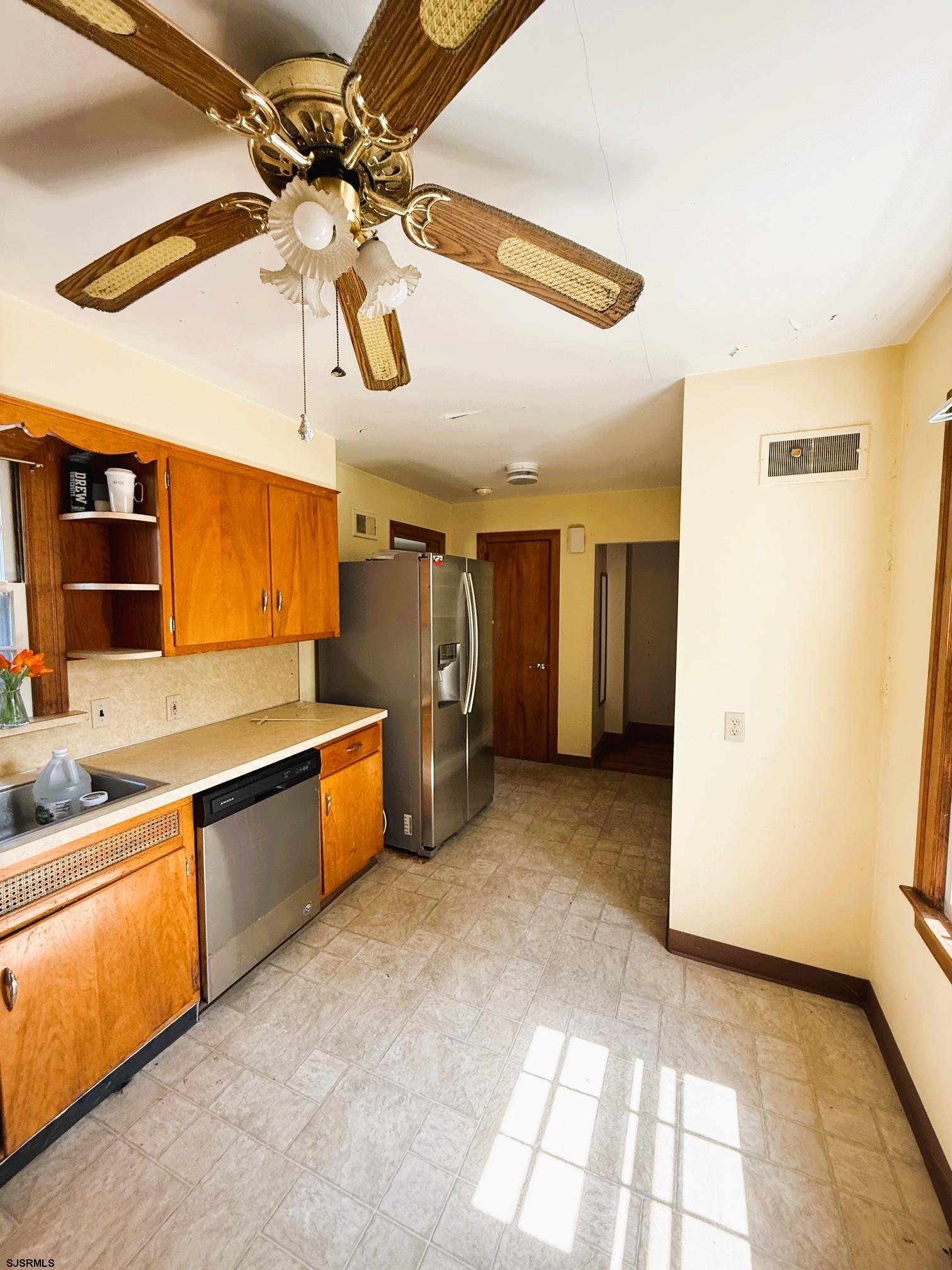 4 East Finley Road Bridgeton, NJ 08302 - Photo 11 of 33 a view of a kitchen with a sink and a refrigerator