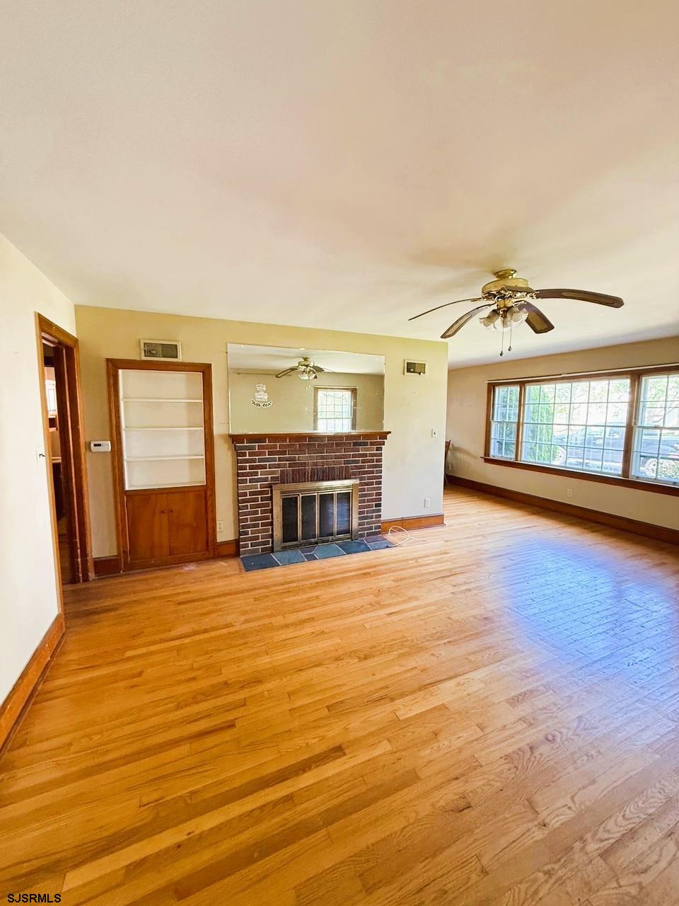 4 East Finley Road Bridgeton, NJ 08302 - Photo 7 of 33 a view of an empty room with a fireplace and a window