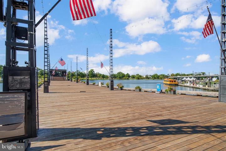 700 7th Street Southwest, Unit 432 Washington, DC 20024 - Photo 13 of 33 Scenic waterfront stage with flags.