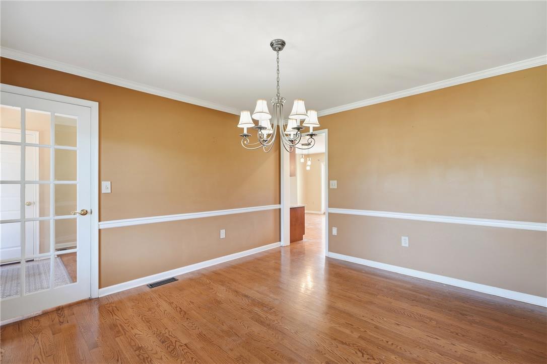 590 Fehr Road Nazareth, PA 18064 - Photo 23 of 79 Classic chair rail molding and polished hardwood floors define this inviting dining room.