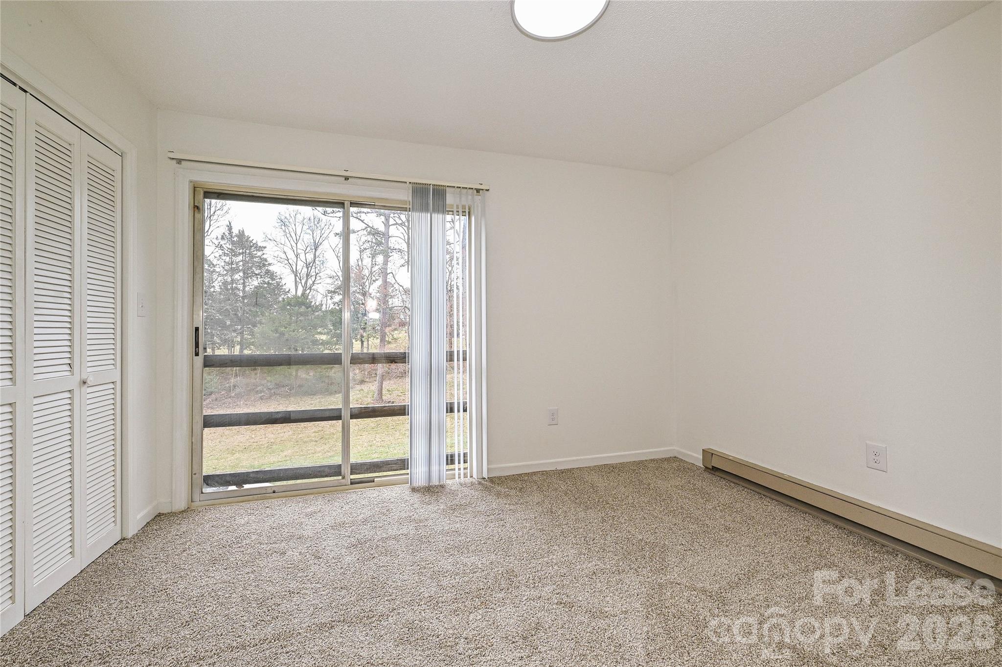 220 McDade Road, Unit 3 Forest City, NC 28043 - Photo 11 of 16 an empty room with a window
