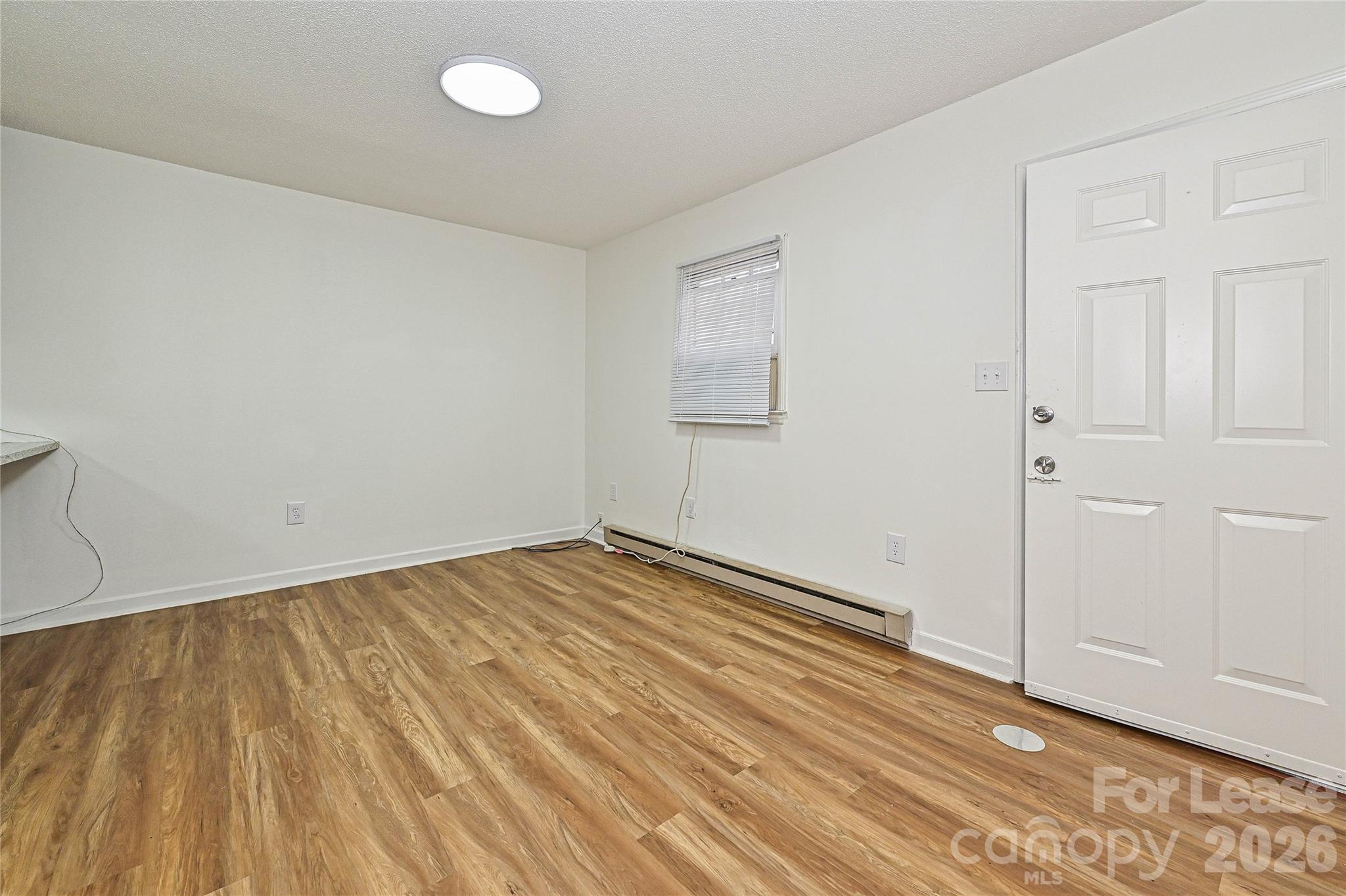 220 McDade Road, Unit 3 Forest City, NC 28043 - Photo 3 of 16 a view of empty room with wooden floor