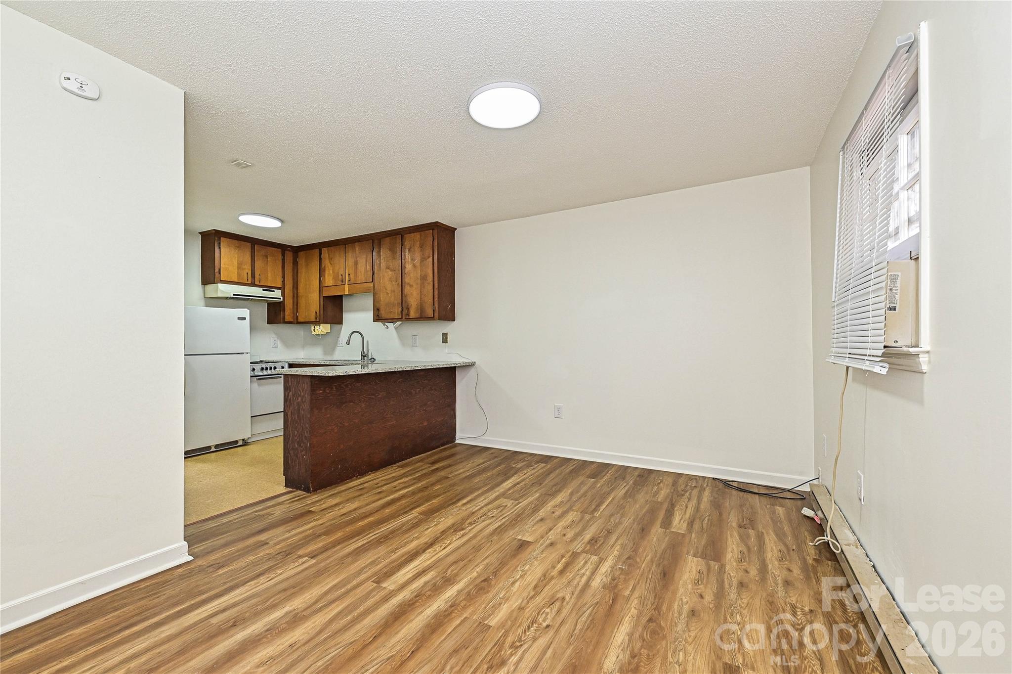 220 McDade Road, Unit 3 Forest City, NC 28043 - Photo 6 of 16 a view of kitchen with wooden floor