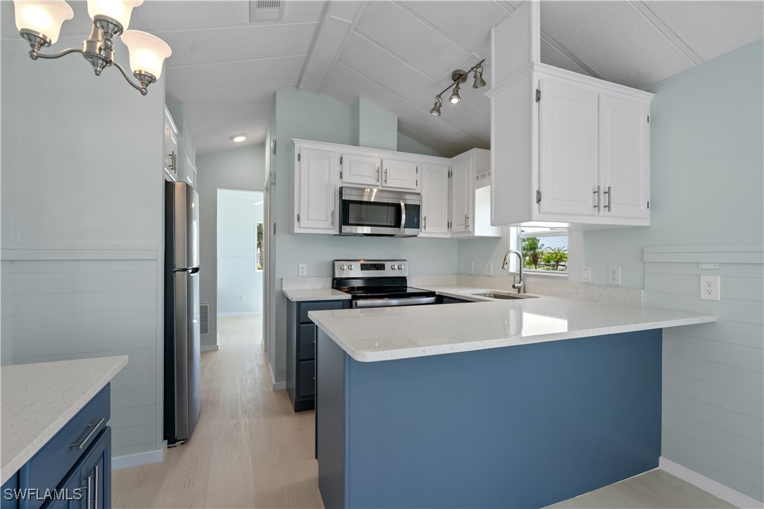 19681 Summerlin Road, Unit 234 Fort Myers, FL 33908 - Photo 16 of 41 a kitchen with stainless steel appliances granite countertop a sink stove and refrigerator