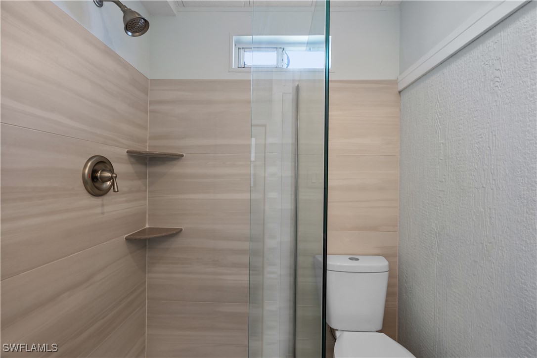 19681 Summerlin Road, Unit 234 Fort Myers, FL 33908 - Photo 23 of 41 a bathroom with a toilet and a shower