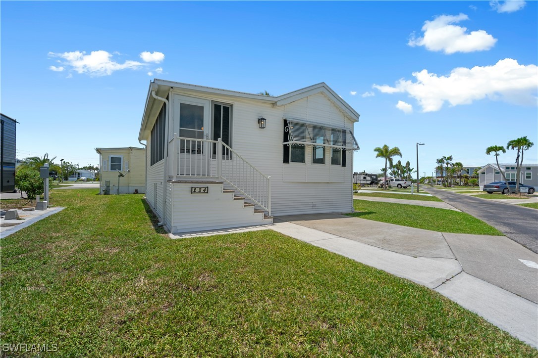 19681 Summerlin Road, Unit 234 Fort Myers, FL 33908 - Photo 3 of 41 a house view with a garden space