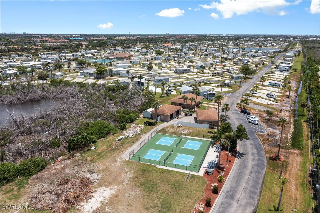 19681 Summerlin Road, Unit 234 Fort Myers, FL 33908 - Photo 32 of 41 an aerial view of a house with a yard