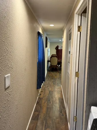 a view of a hallway with a livingroom