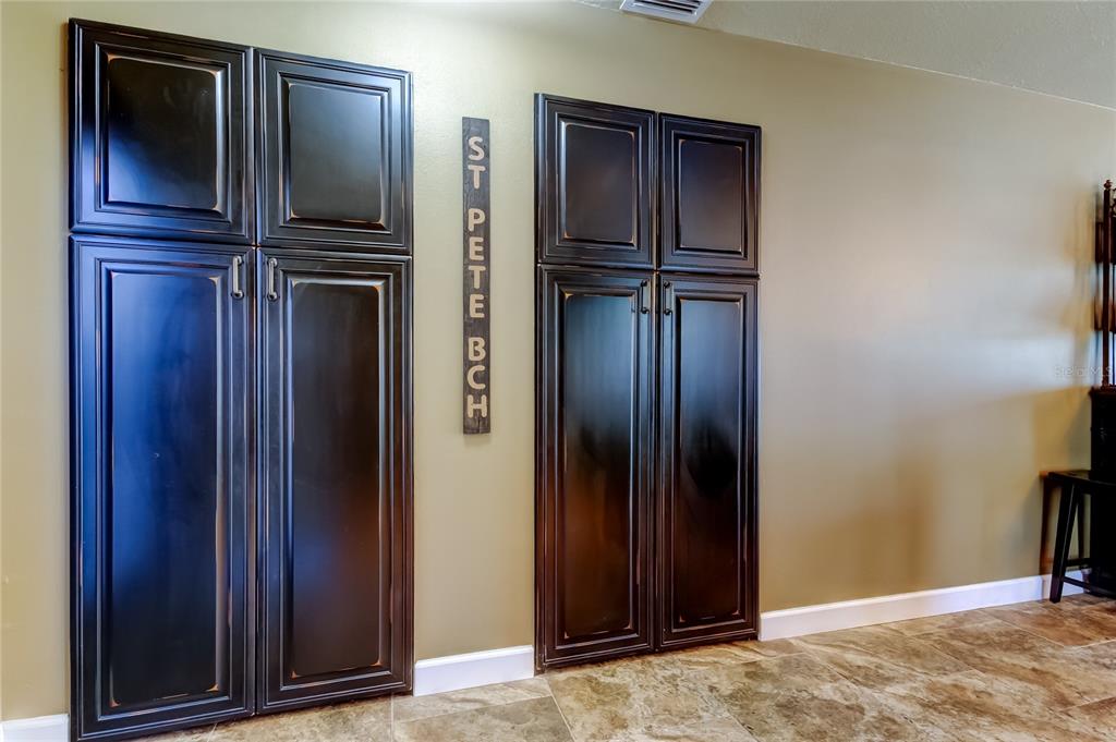 7003 Sunset Way, Unit 1 St. Pete Beach, FL 33706 - Photo 14 of 70 a view of kitchen with stainless steel refrigerator freezer and cabinets