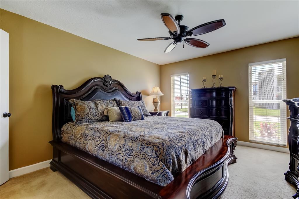 7003 Sunset Way, Unit 1 St. Pete Beach, FL 33706 - Photo 27 of 70 a bedroom with a bed and window