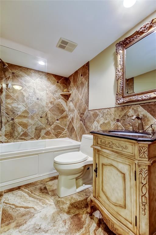 7003 Sunset Way, Unit 1 St. Pete Beach, FL 33706 - Photo 37 of 70 a bathroom with a toilet and a sink