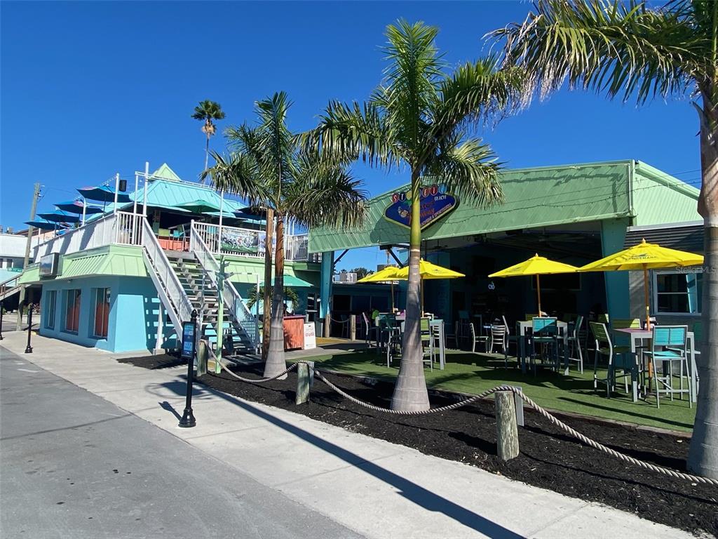 7003 Sunset Way, Unit 1 St. Pete Beach, FL 33706 - Photo 61 of 70 a view of a cafe with sitting area