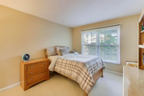 a bathroom with a double vanity sink mirror and shower