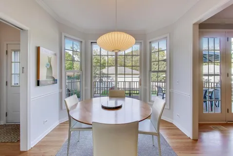 a living room with furniture window and a fireplace