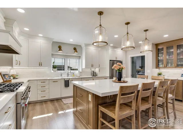a kitchen with a table and chairs in it