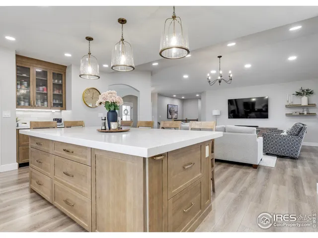 a large kitchen with a lot of counter space and a sink
