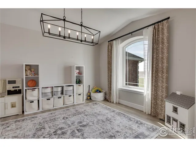 a view of a livingroom with furniture and chandelier